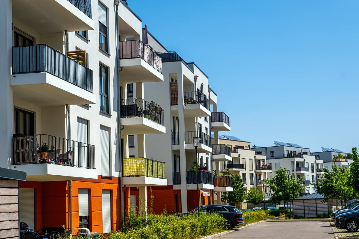 Multifamily residential building exterior photographed at golden hour